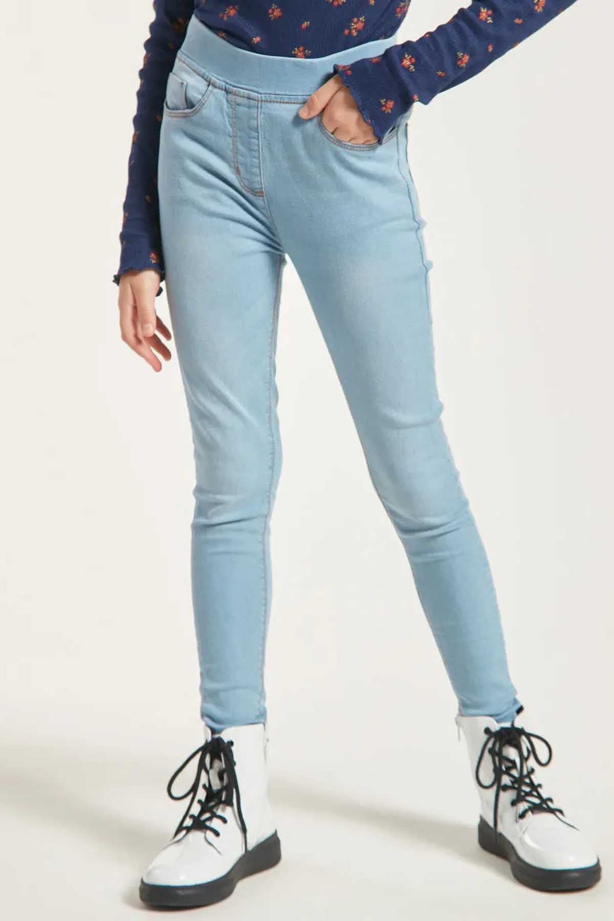 Girls light-blue denim skinny jeans with black lace-up boots