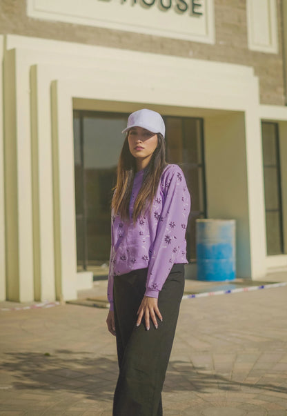 Lavender printed long-sleeve sweatshirt with subtle floral speckle pattern