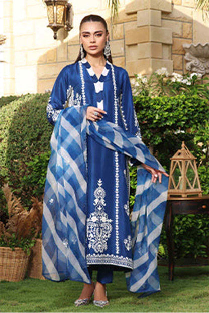 Blue long embroidered dress with white detailing and check dupatta draped over arms