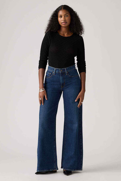 Indigo wide-leg denim jeans with front button, belt loops, and five-pocket design