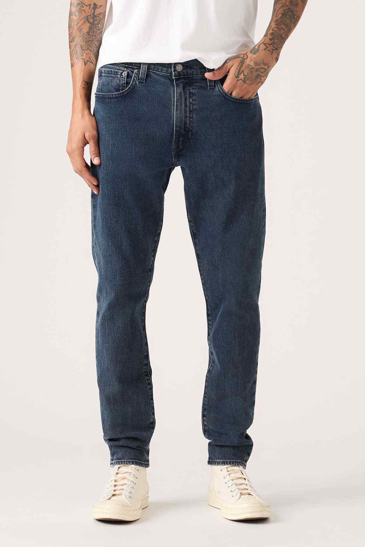 Levi's dark blue straight jeans, front view with stitched pockets