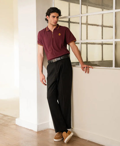 Maroon fitted polo shirt with yellow collar trim and short sleeves, standing pose