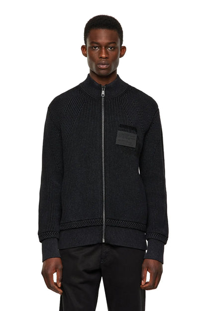 Black knit zip-up jacket with ribbed stand collar and front zipper