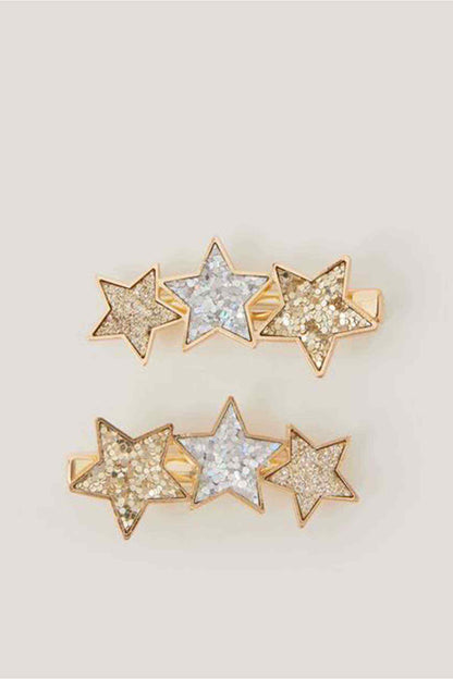 Gold-tone star hair clips with glitter rhinestones in silver, pale blue, and clear