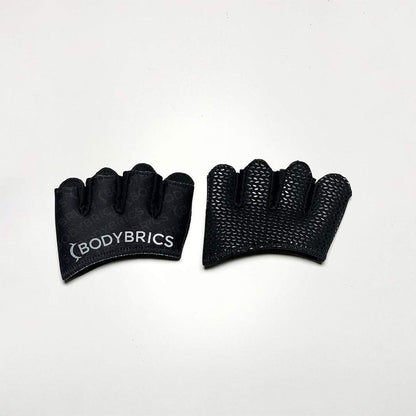 Black fingerless gloves with Bodybrics logo patch, textured grip palms