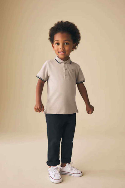 Kids stone polo shirt with navy striped collar and cuffs, button placket
