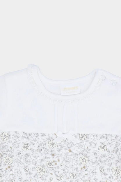 White long-sleeve baby top with ribbed round neckline and small floral print yoke