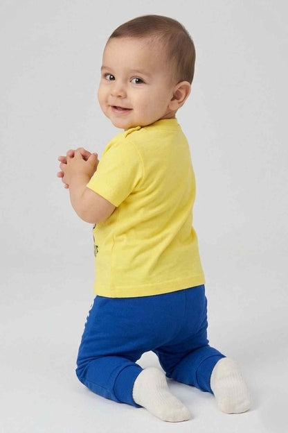 Yellow short-sleeve T-shirt and blue jogger pants, Superman rescue graphic