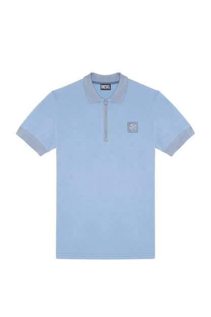Light blue polo shirt with zip-front collar and chest logo patch