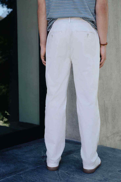 Light beige chino trousers with straight leg and back crease seams