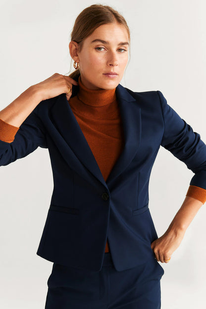 Navy blazer close-up with notch lapel and single front button