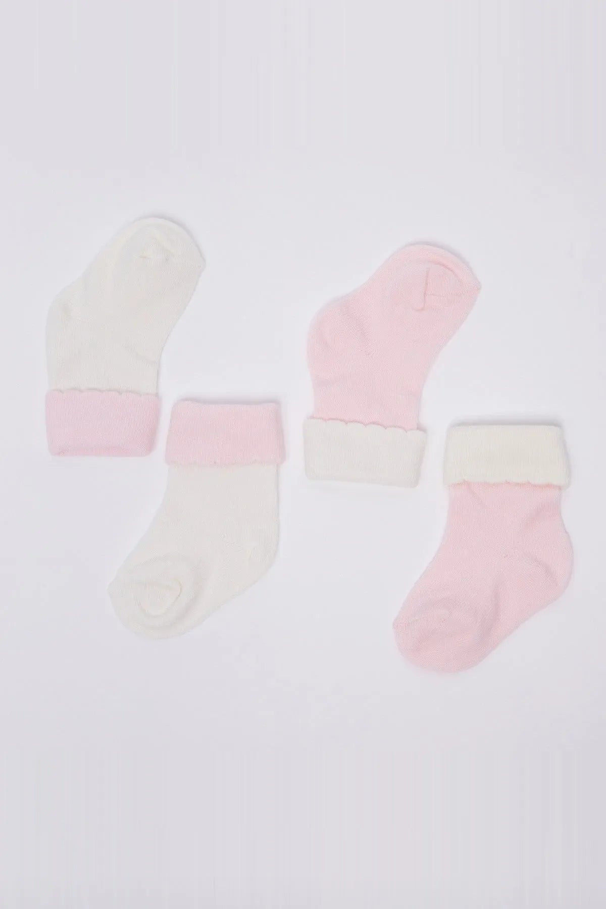 Pink and white baby crew socks, ribbed cuffs and scalloped trim