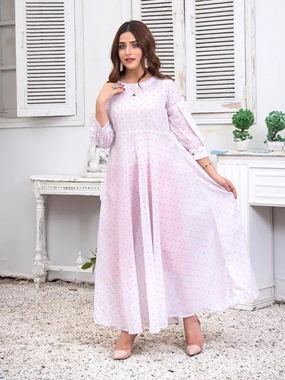 Light pink Nazmina midi dress with flowing skirt, long sleeves, and tiny dotted print