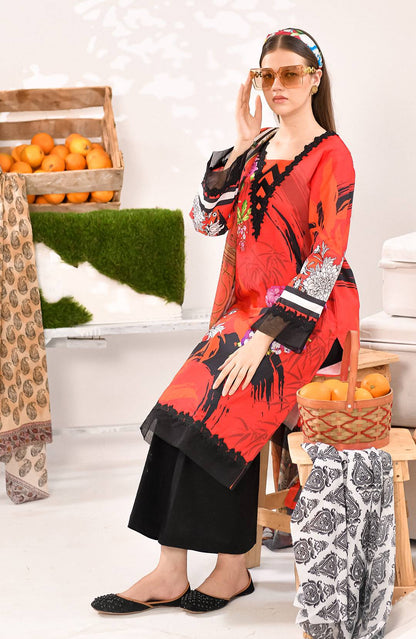 Red tunic kurta with black and white printed cuffs, black pants, side view