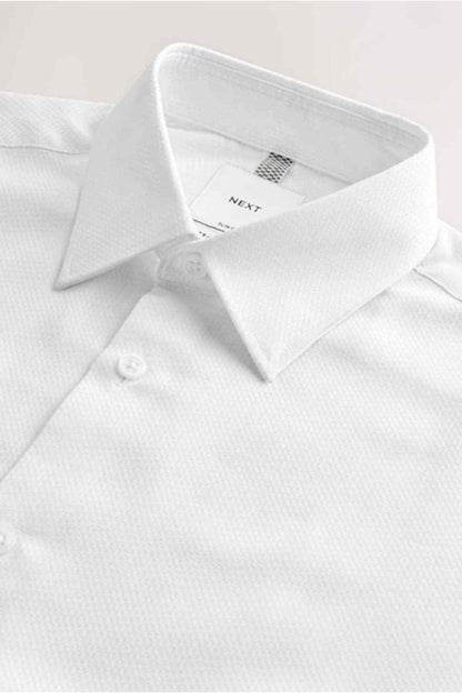 White dress shirt collar and buttoned placket with inner neck label