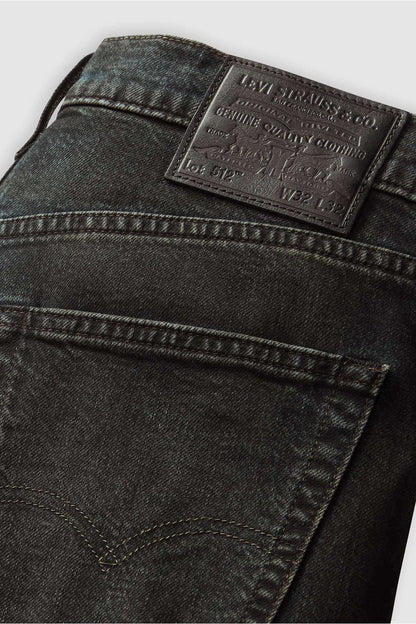 Levi's jeans logo patch on dark denim waistband