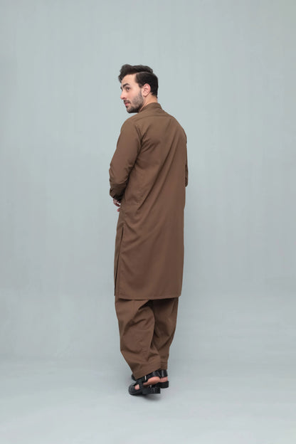 Men's brown long kurta with matching shalwar, side view full length