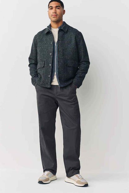 Dark grey straight-leg trousers with belt loops and front button fly