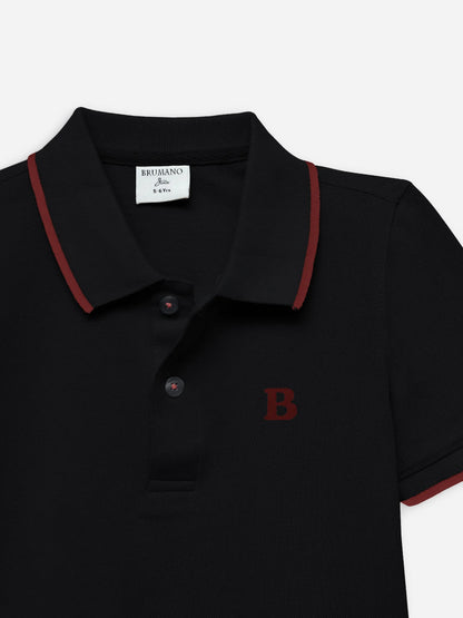 Black polo shirt close-up with red collar trim, button placket, and B logo