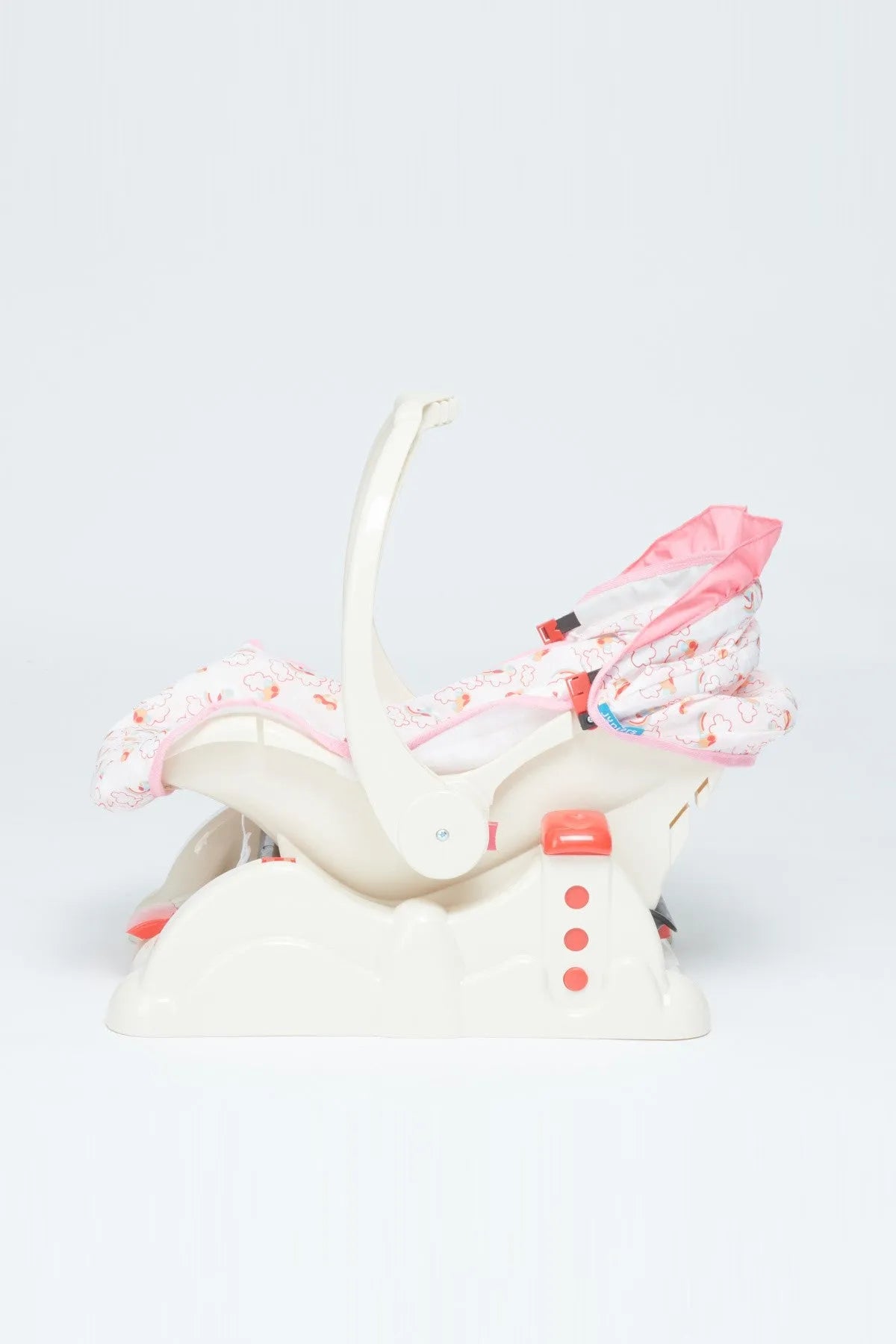 Pink patterned baby seat cover on white rocker base