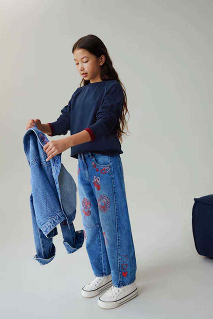 Kids denim jeans with red embroidered motifs, folded cuffs and blue wash
