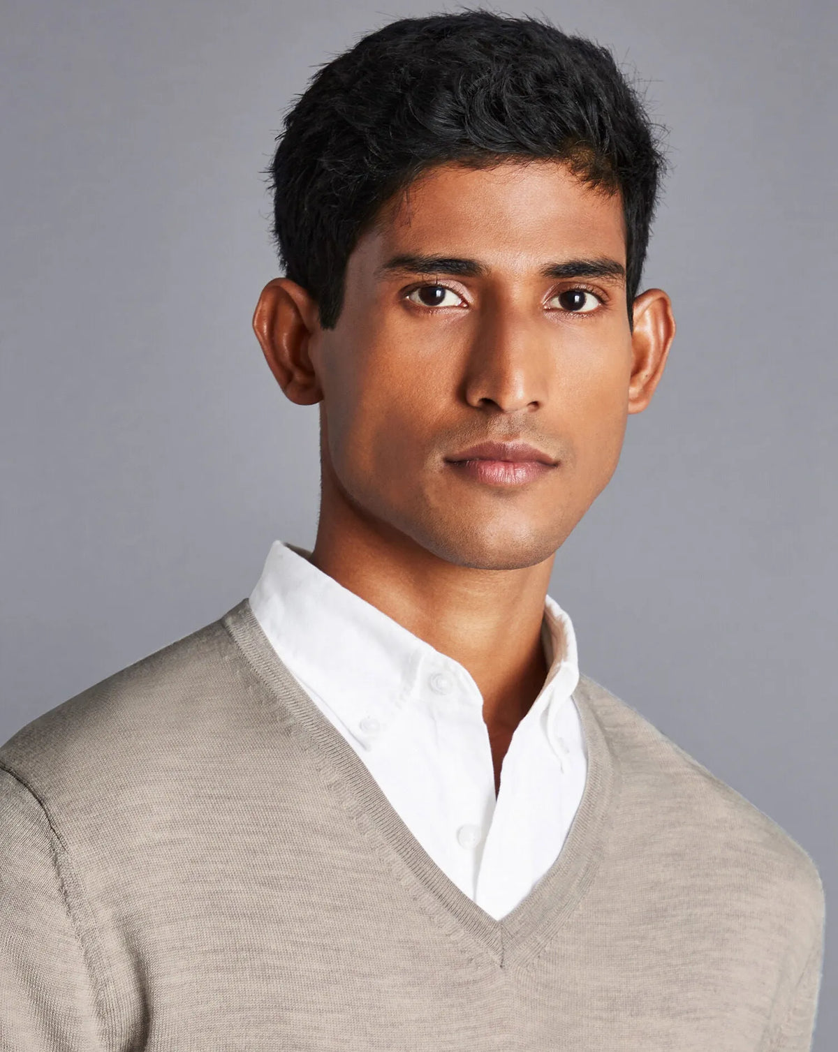 Men's beige V-neck knit sweater with long sleeves