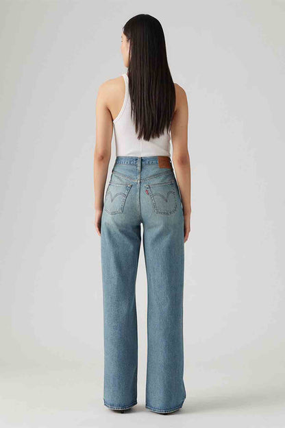 Blue denim wide-leg jeans, back view with belt loops