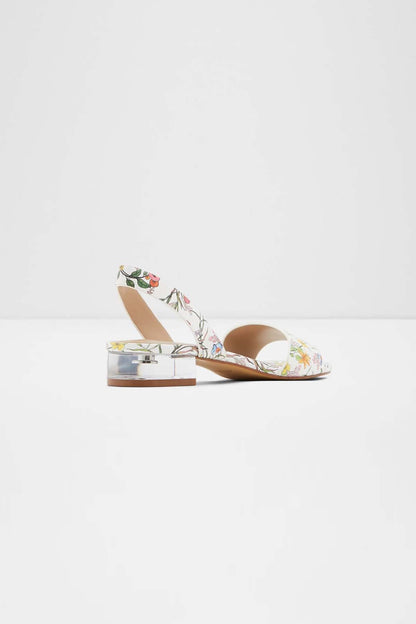 White floral sandals with open toe, low block heel, tan insole and slingback strap
