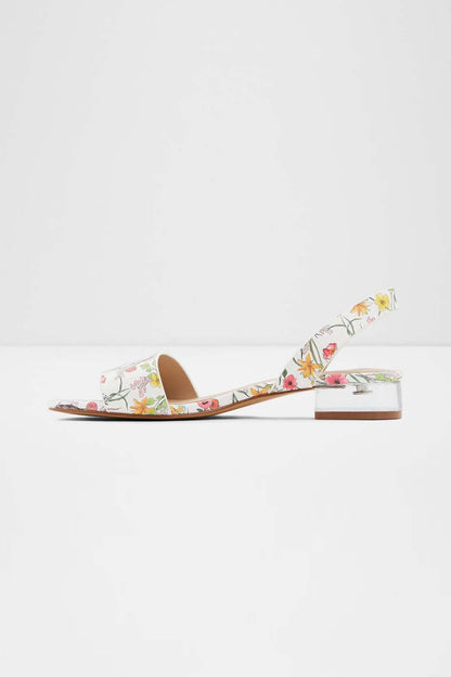 White floral slide sandals with low block heel and open toe, slim ankle slingback