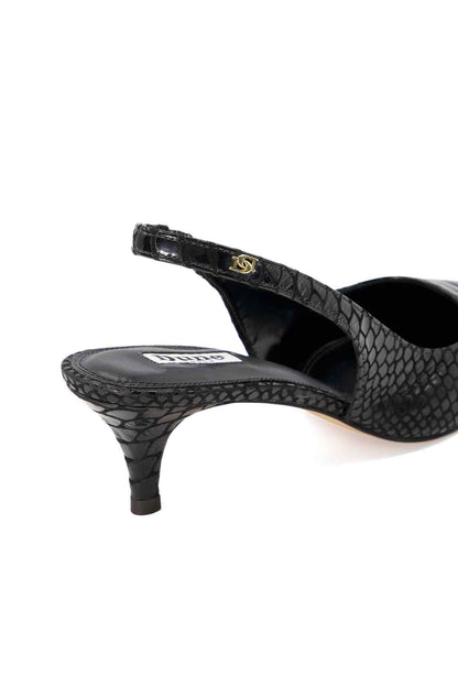 Black snakeskin slingback heel with ankle strap, pointed toe, slim stiletto