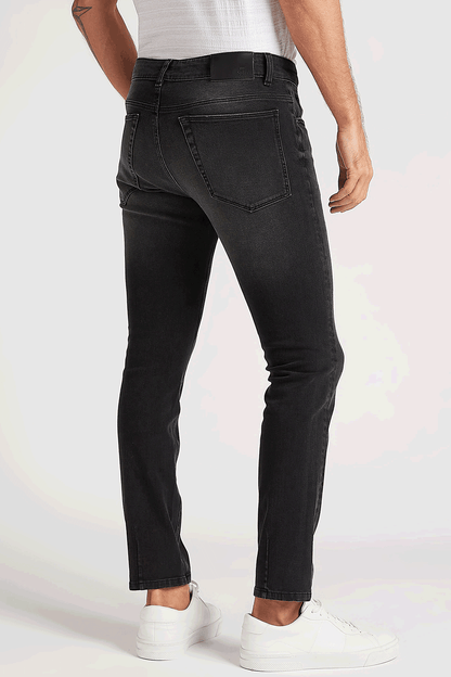 Black distressed jeans with back yoke and orange-brown rip accents