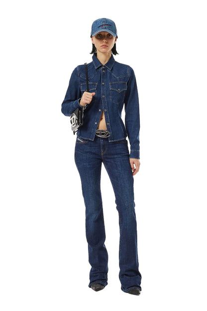 Diesel blue denim jeans worn by model, straight legs with button fly