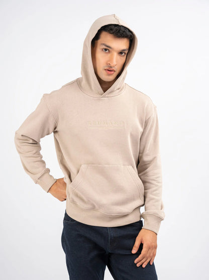 Beige pullover hoodie with front kangaroo pocket and ribbed cuffs