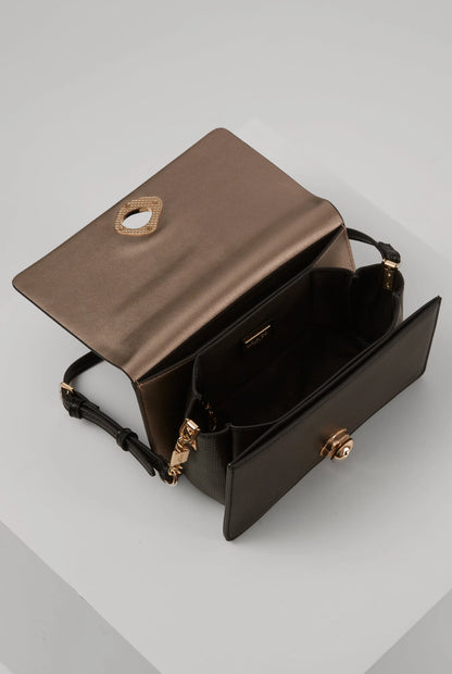 Black shoulder bag open view with interior compartments and gold emblem hardware