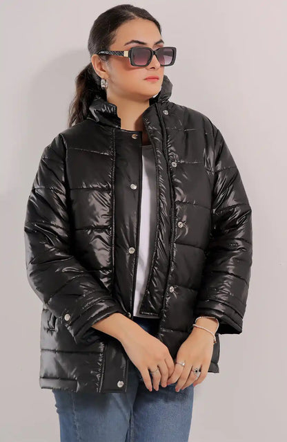 Black quilted puffer jacket with snap-button front and long sleeves
