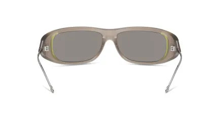 Light taupe sunglasses with gray lenses and green trim at the temples