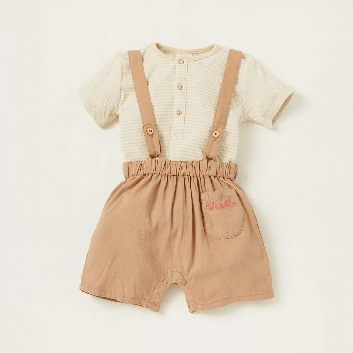Beige baby romper: striped bodysuit with tan suspender shorts
