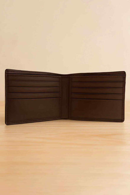 Brown leather bifold wallet interior open, multiple card slots visible