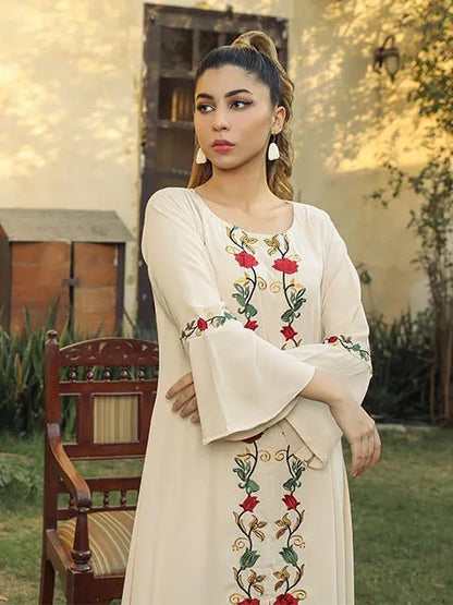 Nazmina cream dress with front floral panel and long flared sleeves, close-up