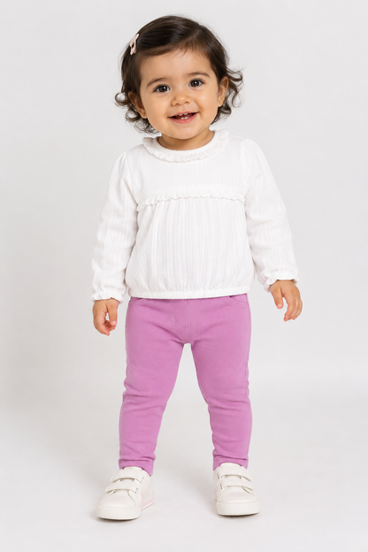 Baby outfit: white ruffle top with long sleeves and purple leggings