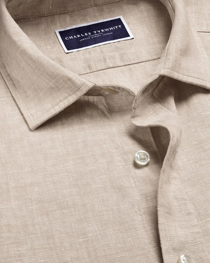 Light beige shirt placket with Charles Tyrwhitt neck label and button