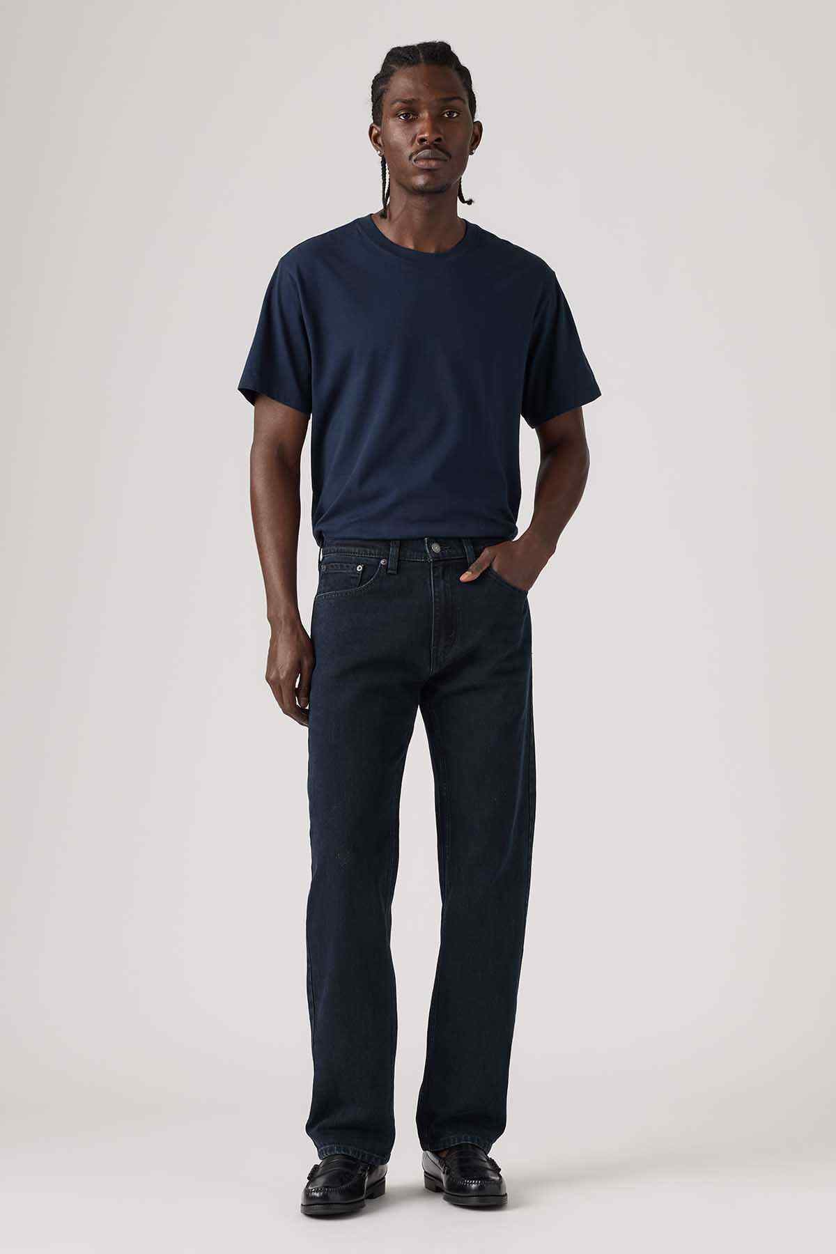 Dark blue denim jeans worn with a short-sleeve tee; relaxed straight-leg fit