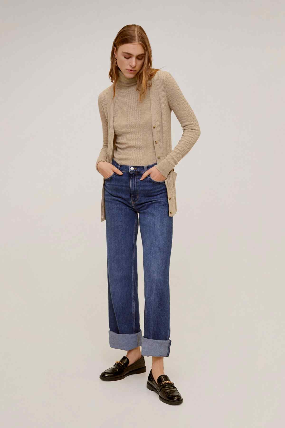 Light pastel grey knit cardigan with button-front, long sleeves and side slits