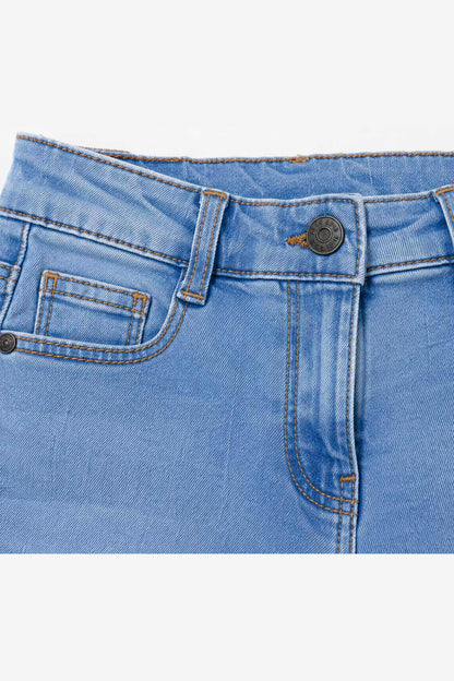Blue denim jeans detail: stitched waistband, button closure, and front patch pocket