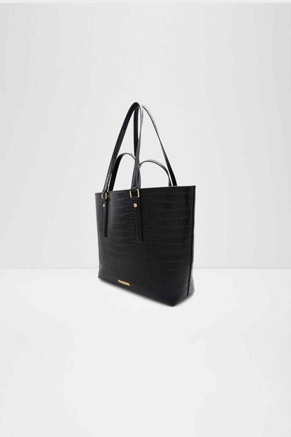 Black tote bag with structured top, front pocket panel, and gold-tone straps