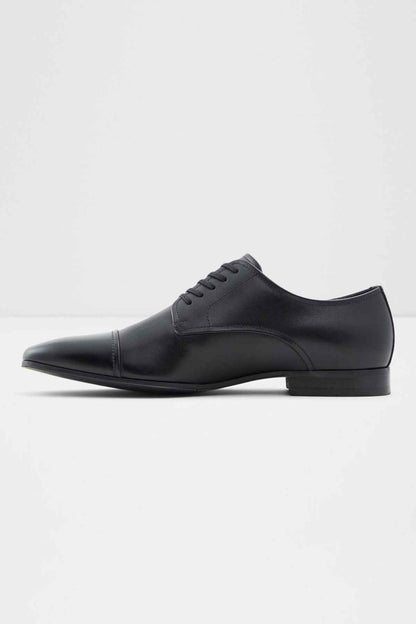 Black leather lace-up oxford shoe, profile view, lace-up vamp