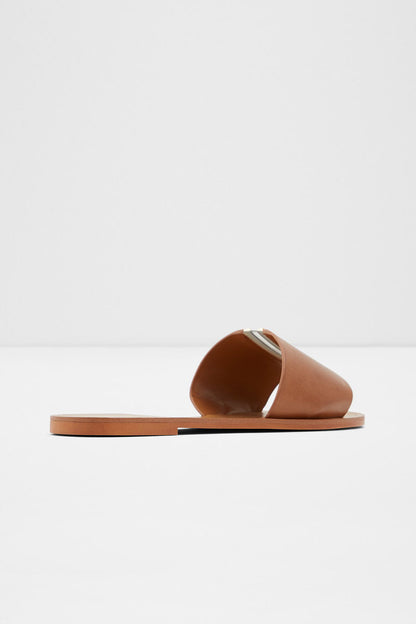 Brown slide sandal with wide toe strap and flat outsole