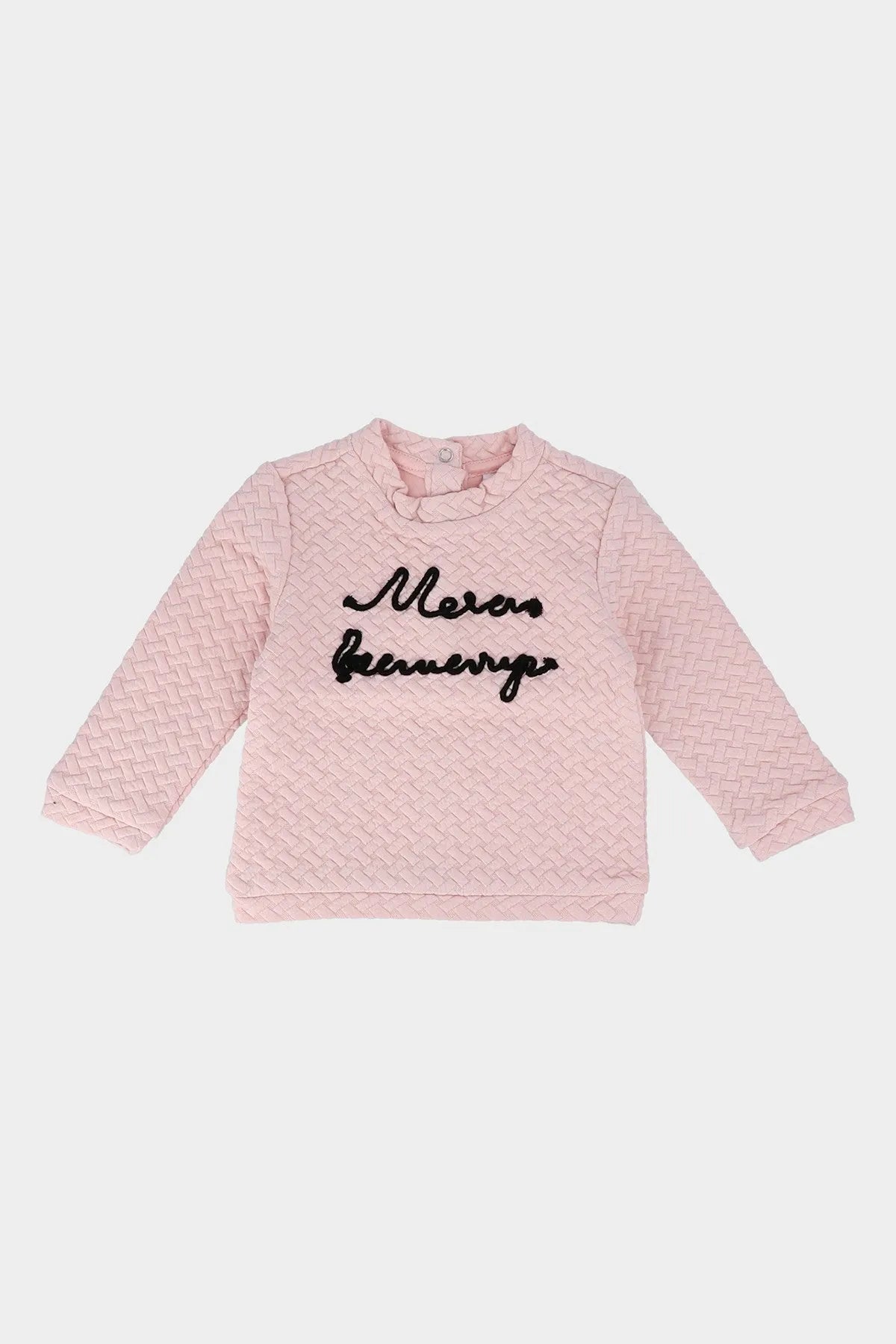 Pink textured long-sleeve baby top with black script logo and button neckline