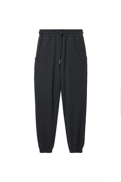 Diesel black jogger pants with elastic waistband, drawstring, and tapered cuffs
