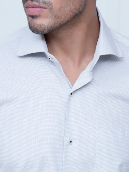Light grey button-up dress shirt with pointed collar, front close-up